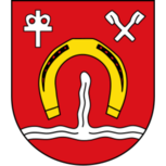 Stadtwappen von Volmerdingsen mit goldenem Hufeisen, silbernen Wellen, kirchlichem Symbol und gekreuzten Bergbauwerkzeugen auf rotem Grund