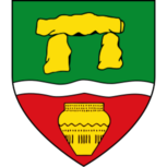 Stadtwappen von Werste in Bad Oeynhausen mit goldenem Megalithgrab auf grünem Grund, silbernem Wellenbalken und goldener Urne auf rotem Feld