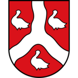 Stadtwappen von Rehme bei Bad Oeynhausen mit silberner Flussgabel und drei Merletten auf rotem Grund
